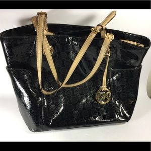 Michael Kors Metallic black shoulder tote handbag.